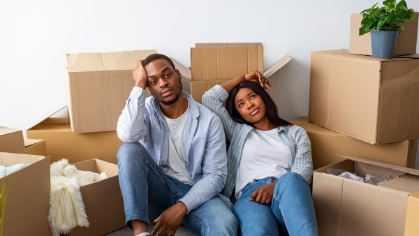 Two people stressed from moving
